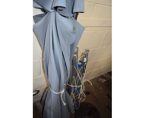 A garden parasol and a rotary washing line