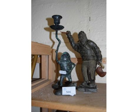 Carved stone model of an inuit, another of a seal and a metal frog candlestick (3)