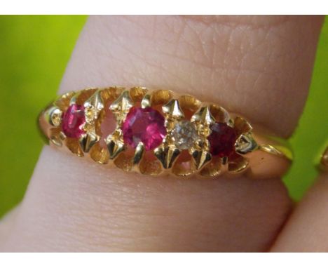 18CT GOLD RUBY AND DIAMOND FIVE STONE RING (ONE MISSING) 3.1G APPROX