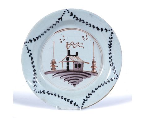 Delftware plate circa 1800, with simple design of house to the centre, 23.5cm
