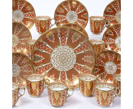 Davenport teaset 19th Century, of coral and gold ground, comprising bread and butter dish, 13 cups and 11 saucers