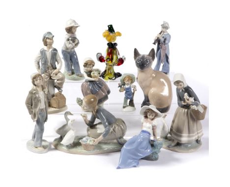 Collection of Lladro and Nao porcelain figures a Royal Copenhagen porcelain model of a Siamese cat and a Murano glass model o