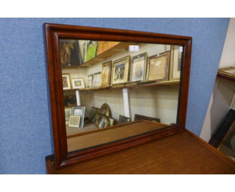 A Victorian walnut cushion framed mirror, 48 x 64cms 