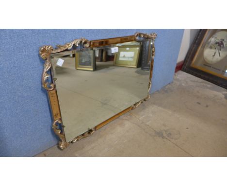 A peach and copper effect framed mirror 