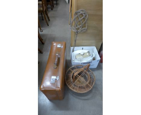 A stoneware hot water bottle, two ceramic douche pans and a suitcase 