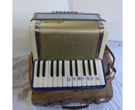 A Monika student accordion and case 