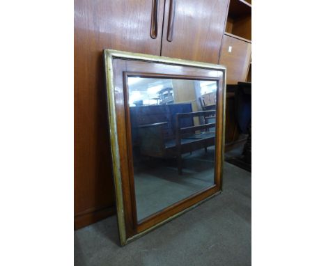A Victorian walnut and parcel gilt framed mirror, 87 x 78cms 