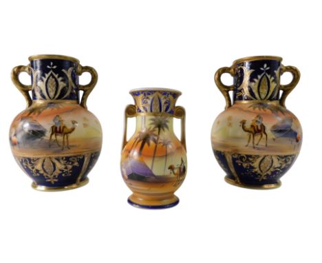 A pair of Noritake porcelain vases, each decorated with an Arab scene with camels, tents, etc., 20cm high, and a similar smal