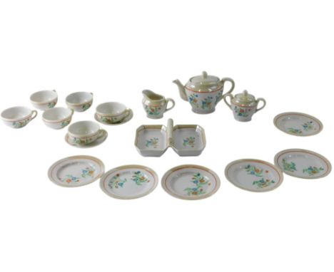 A Continental porcelain child's tea service, with printed and painted decoration and flowers, on a lustre ground, boxed.