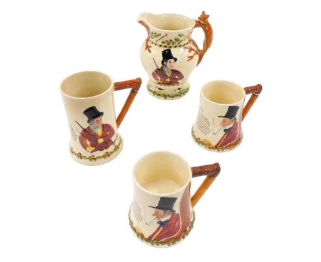 A Crown Devon John Peel jug, with fox handle, a music John Peel mug, another without musical instrument, and a larger mug. (4