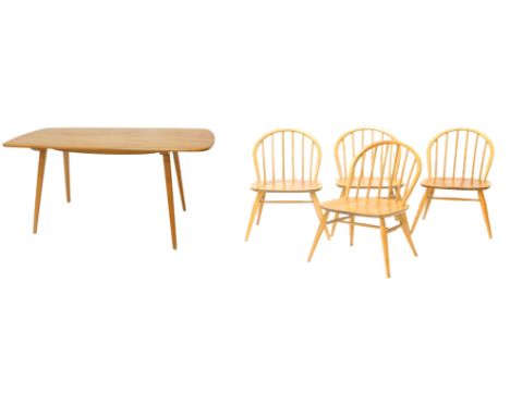 An Ercol light elm dining table, the rectangular top with rounded corners, on tapering legs, 73cm high, the top 74cm x 150cm,
