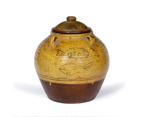 Michael Cardew (1901-1983) at Winchcombe Pottery Jar and cover slipware, decorated with fish, with four lug handles  impresse