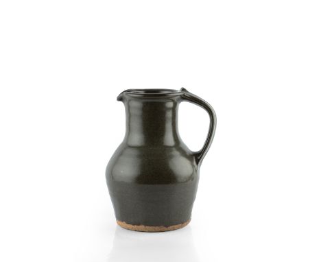 Bernard Leach (1887-1979) at Leach Pottery Jug dark green glaze impressed potter's and pottery seals 23.5cm high.