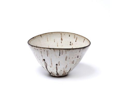 Lucie Rie (1902-1995) Bowl elliptical form, with cream glaze and manganese drips impressed potter's seal 9cm high, 16cm acros
