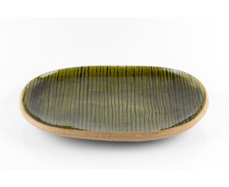 Michael Leach (1913-1985) at Yelland Pottery Dish green and brown slip decoration impressed pottery seal 38.5cm across.
