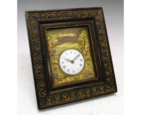 Continental relief-decorated wall clock, having a white-enamelled convex Roman dial, the surround depicting a stag in a lands