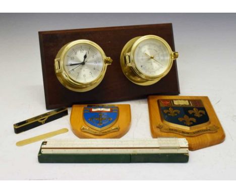 Ship's style wall clock and barometer, heraldic shields, brass bound spirit level, etc