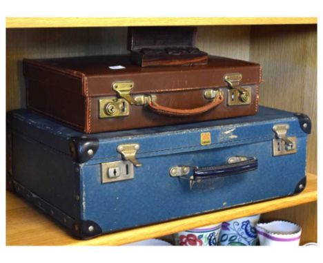 Vintage leather attaché case and brass inlaid cased dice, and blue 'Apex Luggage' case