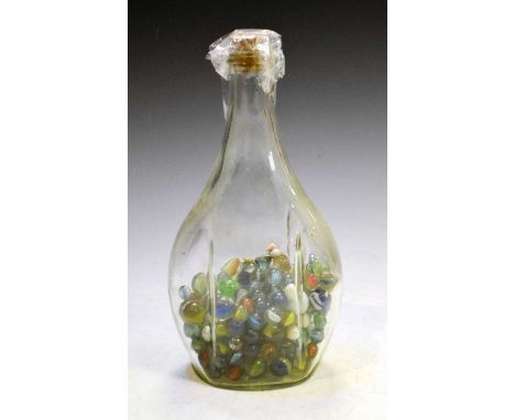 Moulded glass bottle of vintage marbles, 34cm high overall
