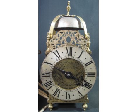 17TH CENTURY STYLE BRASS LANTERN CLOCK the face marked H.Cooley of London, having steel bell, engraved pierced dolphin panels