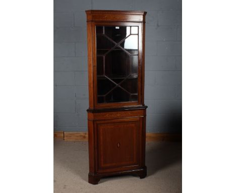 Edwardian mahogany and inlaid corner cabinet, the top section with a single astral glazed door enclosing two shelves above a 