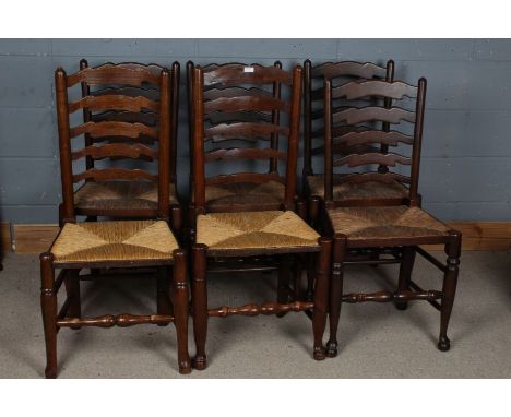 Six oak ladder back dining chairs, all with rush seats, largest 100cm high&nbsp;