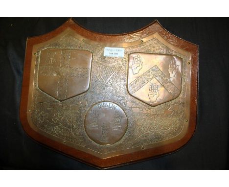 Irish copper and wooden plaque, with three coat of arms to include Dublin together with the Irish harp, signed D. Barret to t