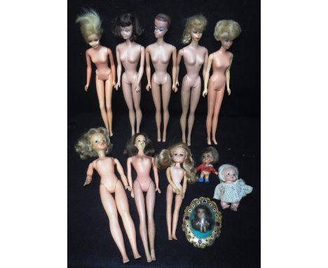 MATTEL: Two 1960s 'Barbie' dolls, two 'Midge' dolls a 'Twiggy' doll, three similar vintage dolls, two 'Lucky Pocket' dolls an
