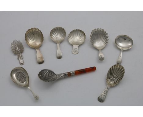 ASSORTED CADDY SPOONS:- A George III small filigree caddy spoon, initialled "R", c.1800, a filigree caddy spoon with an agate
