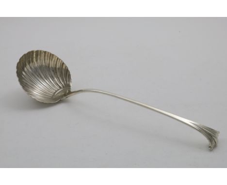 AN EARLY GEORGE III ONSLOW PATTERN SOUP LADLE with a fluted circular bowl, by George Baskerville, London 1763;  13.4"  (34 cm