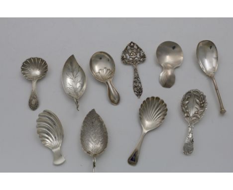 TEN VARIOUS 20TH CENTURY CADDY SPOONS to include a Scottish pierced example and another with an enamelled pennant on the term