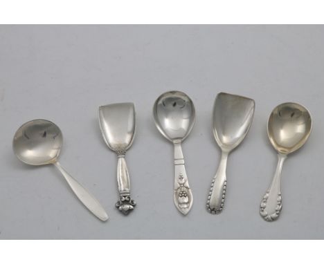 BY GEORG JENSEN:- Five 20th century Danish caddy spoons (including two with scoop bowls); the largest one 4.5" (11.4 cms) lon
