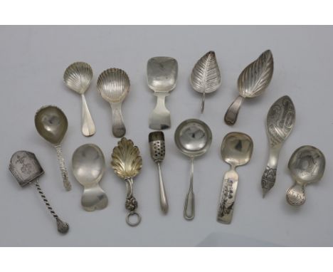 FIVE 19TH CENTURY FRENCH CADDY SPOONS with leaf bowls, another with an engraved cartouche in the bowl and initialled "MT", th