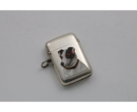 AN EDWARDIAN VESTA CASE of plain rounded oblong form, enamelled on the front with the portrait of a Jack Russell terrier, the