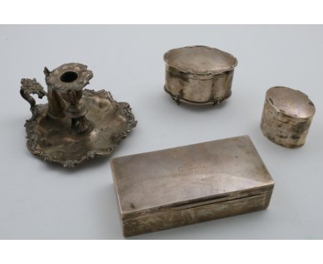 A WILLIAM IV CHAMBERSTICK of shaped circular outline with a husk and scroll border, detachable nozzle and conical snuffer, in