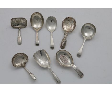 A GEORGE III CADDY SPOON with a filigree panel in the bowl, by Samuel Pemberton, Birmingham 1801, four various caddy spoons w