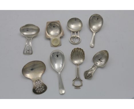 EIGHT VARIOUS 20TH CENTURY CADDY SPOONS including a Scottish example and an unmarked example chased with a thistle;  the latt