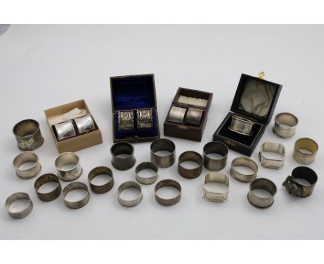 NAPKIN RINGS:- A single napkin ring (boxed), a cased pair of pierced napkin rings, initialled, a cased pair of plain napkin r