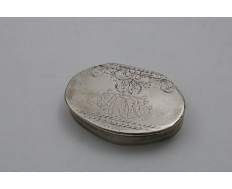 A GEORGE I SNUFF BOX of cartouche outline with engraving and a cypher on the cover, the base engraved with a coat of arms* wi