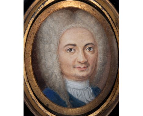 ENGLISH SCHOOL C.1740 Portrait of a gentleman* wearing a wig and blue coat, bust length, on ivory;  4.5 x 3.25 cms *Said to b