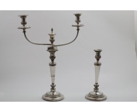 A SET OF FOUR OLD SHEFFIELD PLATED CANDLESTICKS on circular bases with tapering columns and gadrooned borders, crested, by Ma