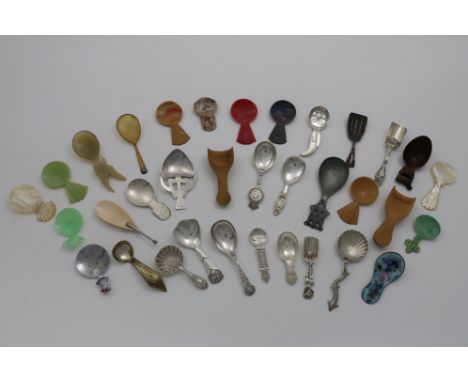 TWO UNASCRIBED LATE 19TH / EARLY 20TH CADDY SPOONS (an Art Nouveau example, initialled, and a smaller example with a lug hand