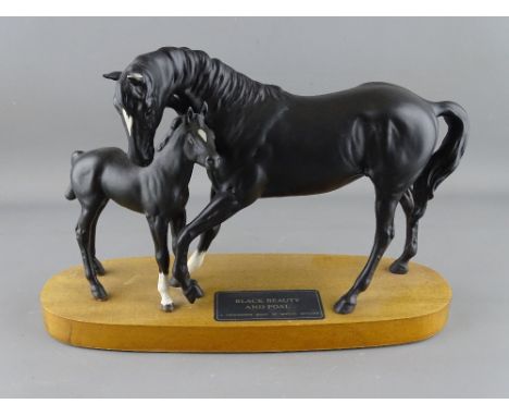 Beswick pottery model of Black Beauty and Foal on a wooden plinth A/F