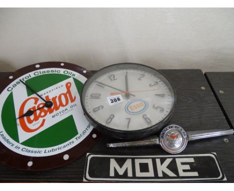 Castrol wall clock, Esso wall clock, Morris vehicle mascot and a Moke vehicle badge