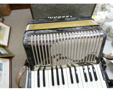 Cased Hohner of Germany twelve base accordion, retailed by Bell