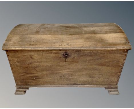 A 19th century oak dome topped shipping trunk.
