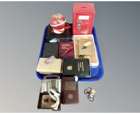 A tray containing vintage banking collectables including Nottingham, Surrey Trustee, Lloyds, East Anglian, Martins Saving Ban