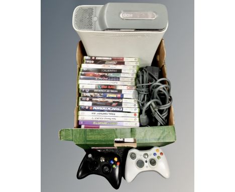 A box of Xbox 360 games, console and two controllers 