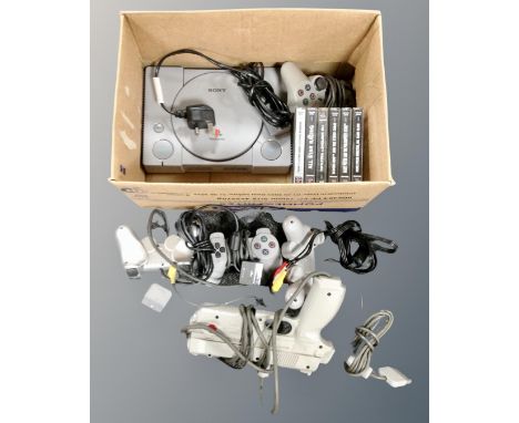 A box of six Playstation games, controller, console and Namco pistol 