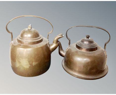 Two vintage copper kettles.